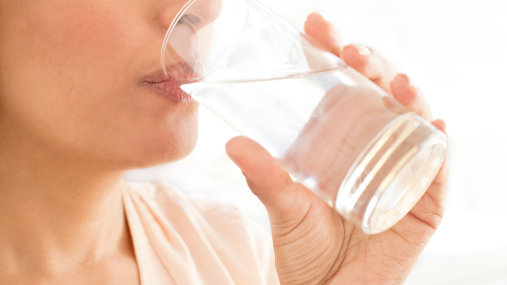 Woman drinking a glass of water 